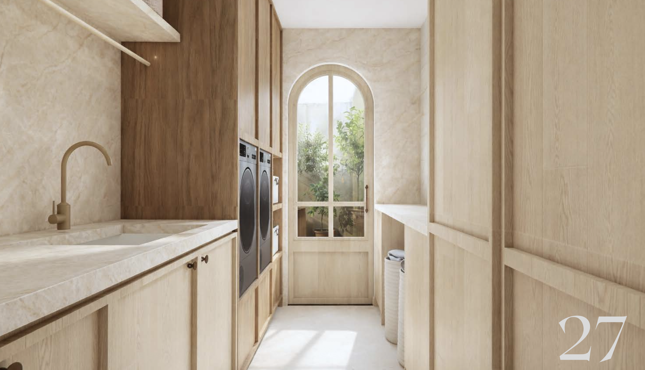 3D render of Cliff Road laundry looking toward arched garden door, Taj Mahal stone bench with integrated sink, brass tapware, oak and walnut cabinetry with side by side washer and dryer, Ki Interiors
